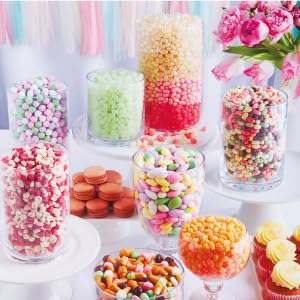 Image of a dessert table, with different sized container that are filled with Jelly Belly candy